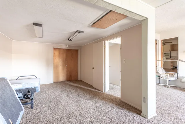 a view of a livingroom with furniture and storage