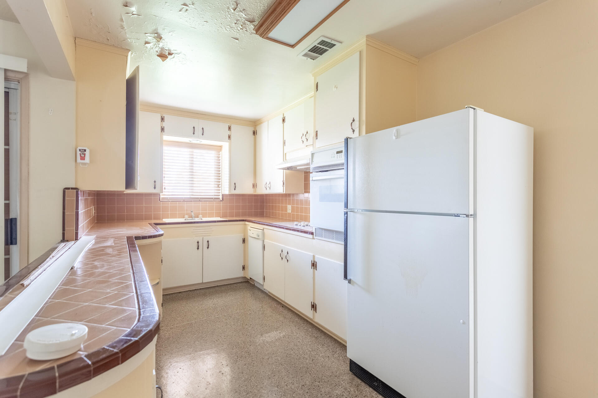 2381 South Bonnyview Road Redding, CA 96001 - Photo 6 of 26 a white refrigerator freezer sitting inside of a kitchen