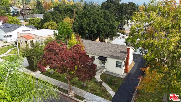 a view of a house with a garden