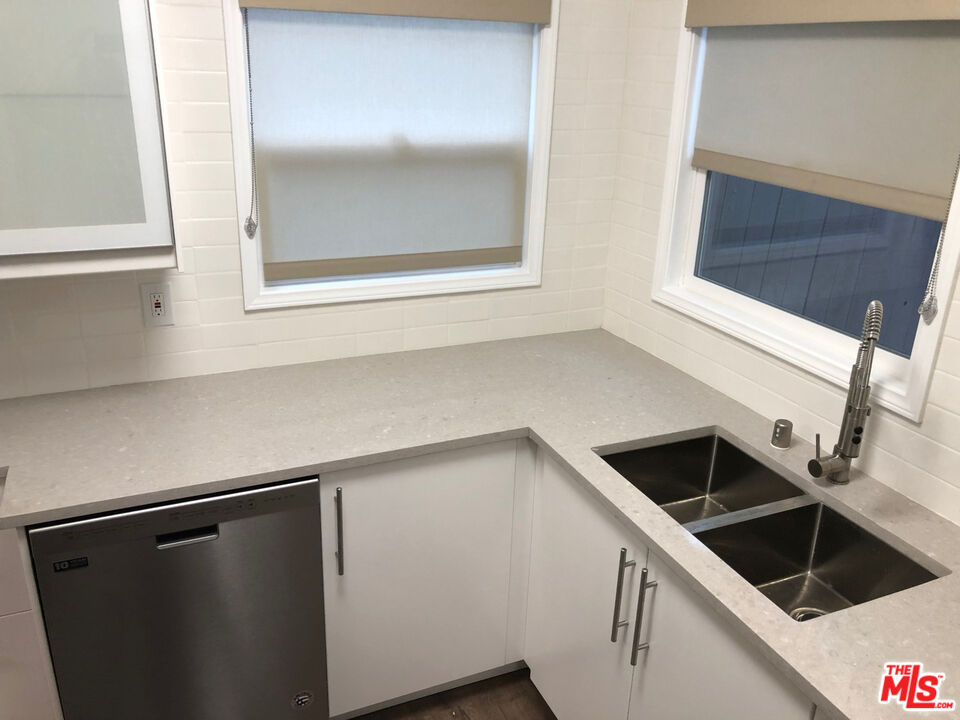 137 North Myrtle Avenue Monrovia, CA 91016 - Photo 20 of 41 a kitchen with a refrigerator and a sink