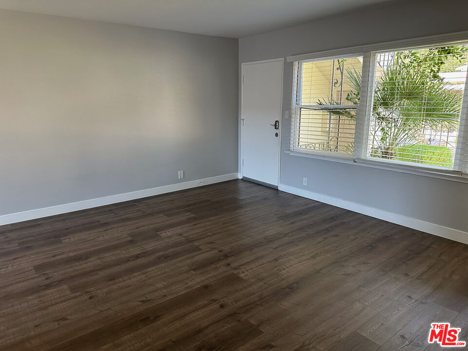137 North Myrtle Avenue Monrovia, CA 91016 - Photo 23 of 41 a view of an empty room with wooden floor and a window
