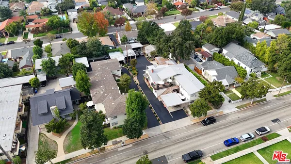 a aerial view of a house with a yard