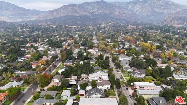 an aerial view of a city with streets and trees