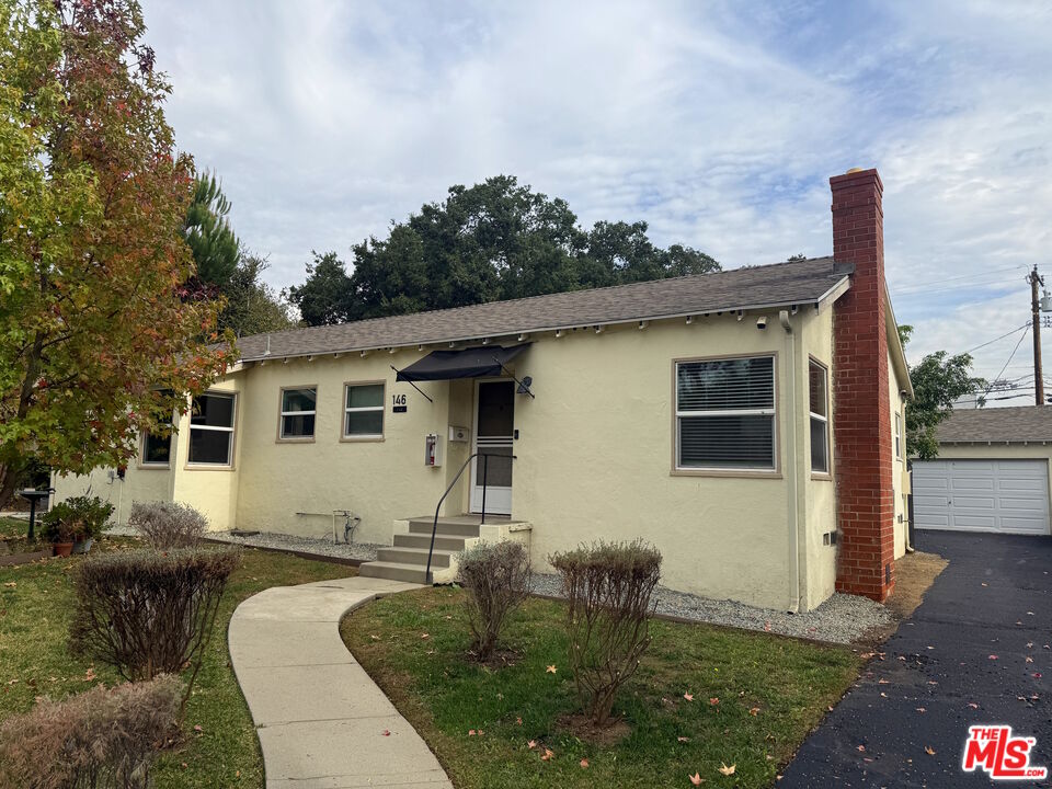 137 North Myrtle Avenue Monrovia, CA 91016 - Photo 31 of 41 a front view of a house with garden