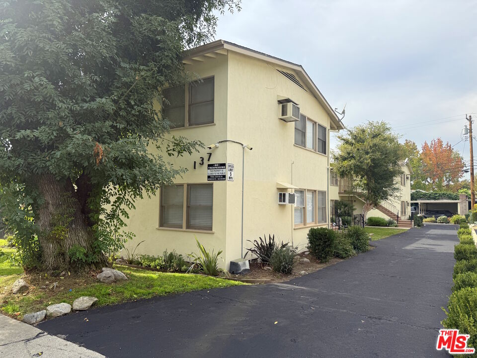 137 North Myrtle Avenue Monrovia, CA 91016 - Photo 37 of 41 a front view of a house with a yard and garage