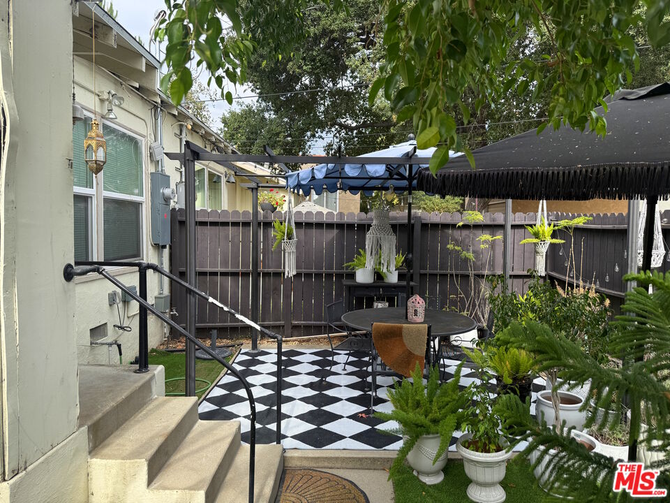 137 North Myrtle Avenue Monrovia, CA 91016 - Photo 8 of 41 a view of a chairs and table in backyard