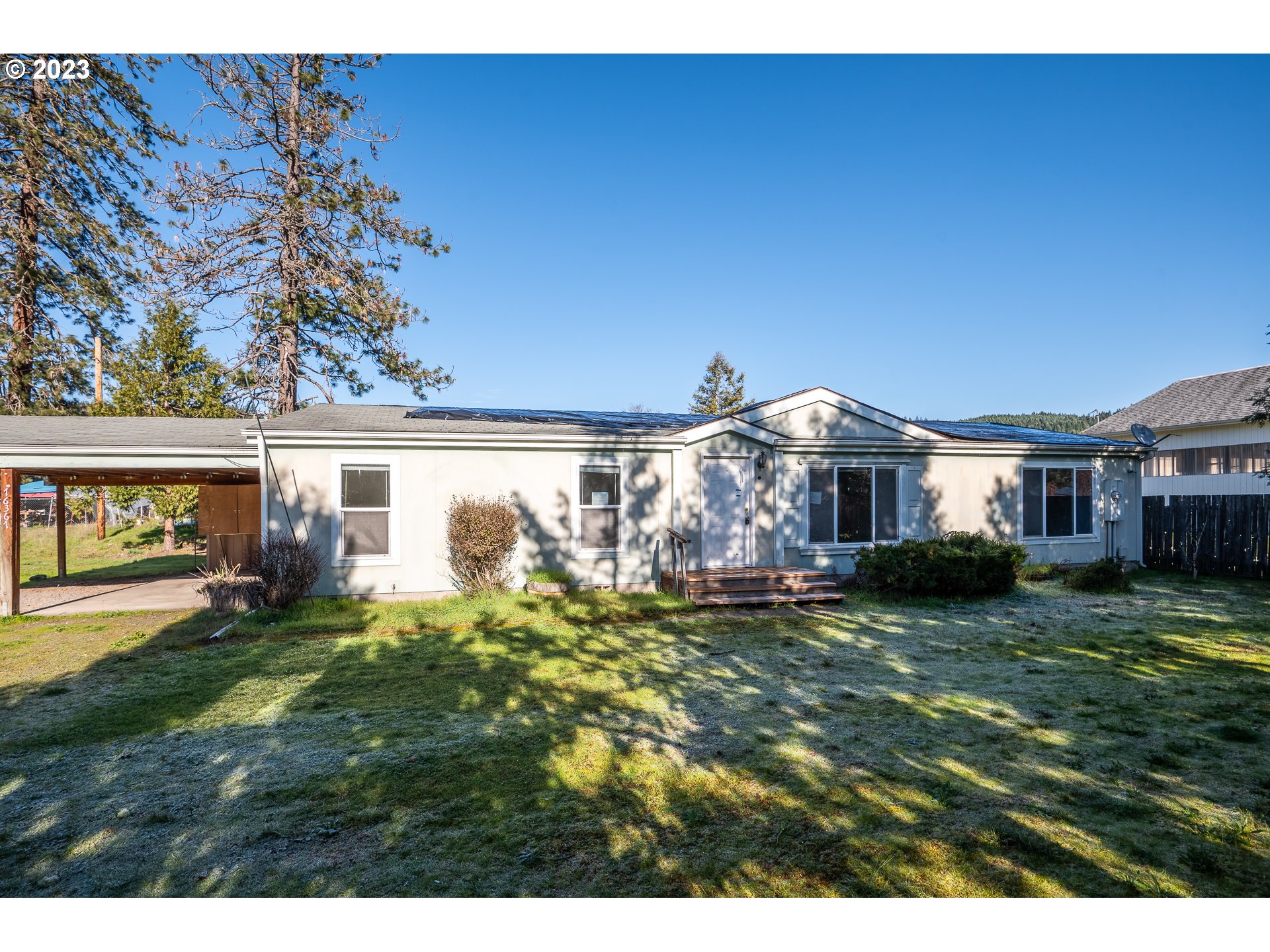 76367 Klohn Road Oakridge, OR 97463 - Photo 1 of 42 a front view of a house with a garden