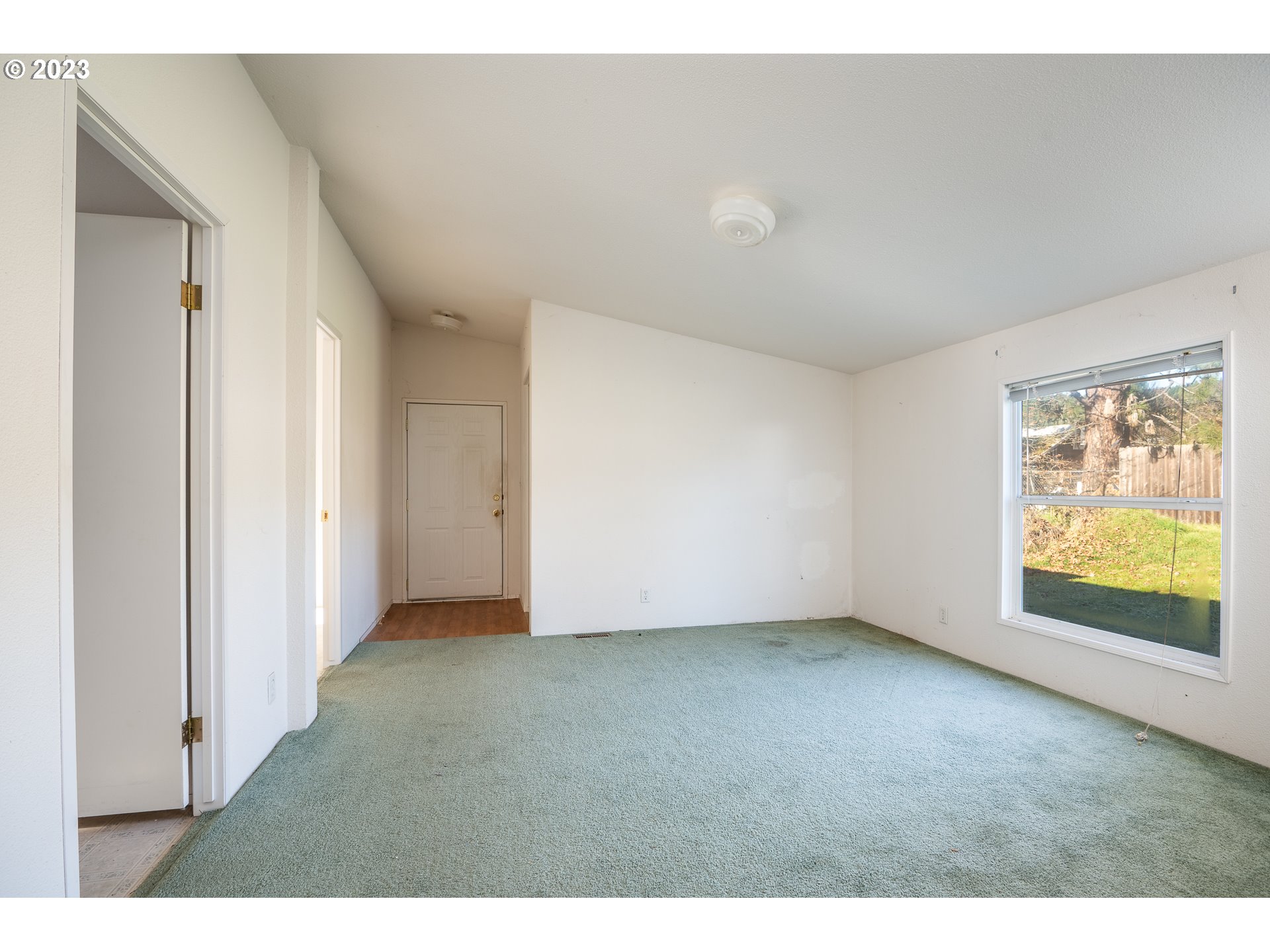 76367 Klohn Road Oakridge, OR 97463 - Photo 17 of 42 a view of an empty room with a window