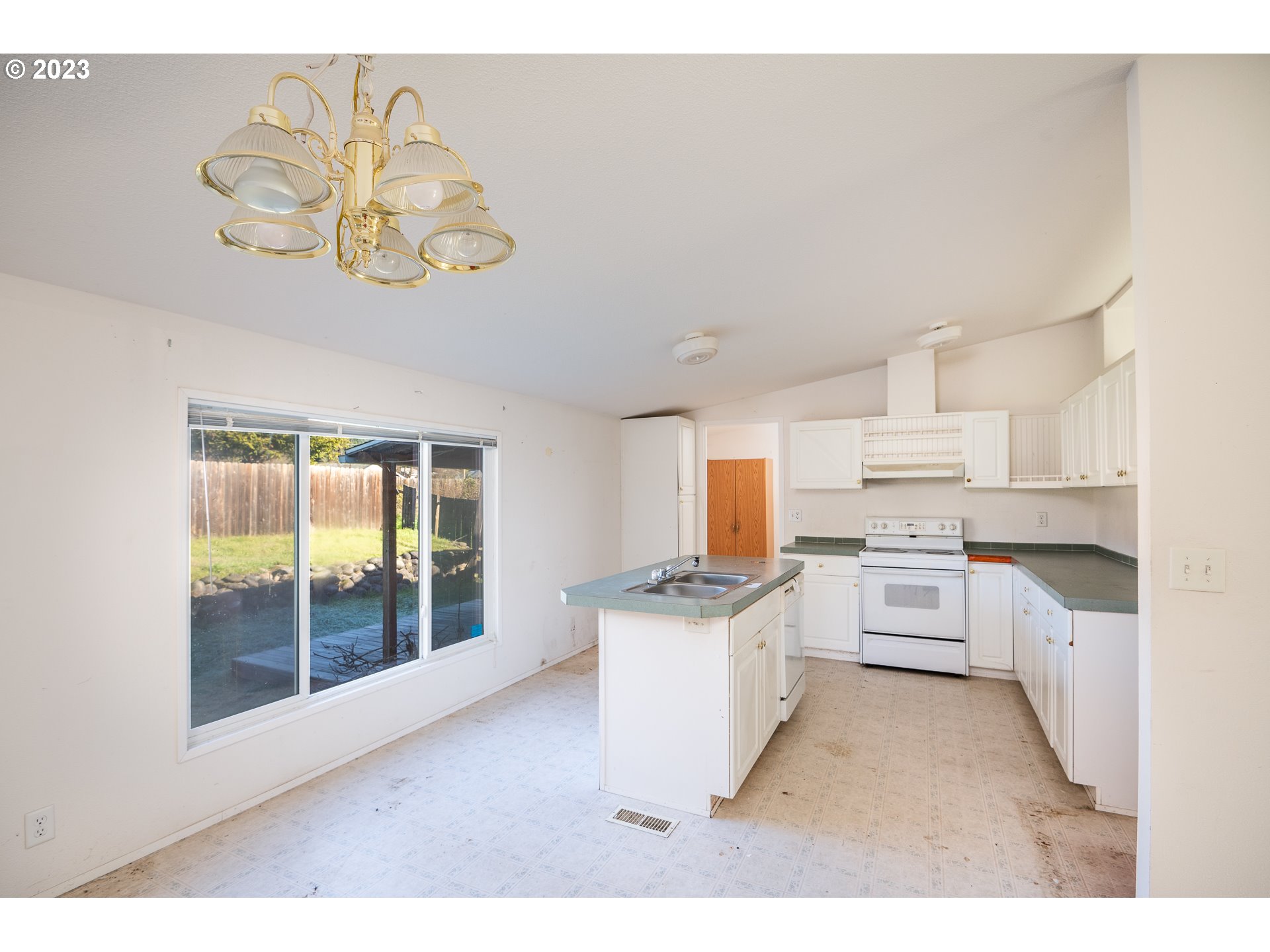76367 Klohn Road Oakridge, OR 97463 - Photo 19 of 42 a kitchen with a stove a refrigerator and a microwave