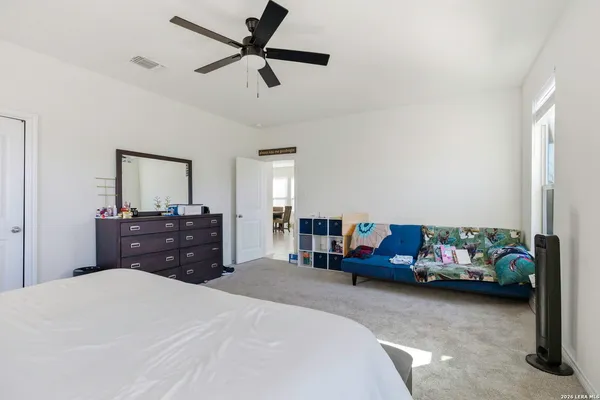 a bedroom with a bed and a dresser