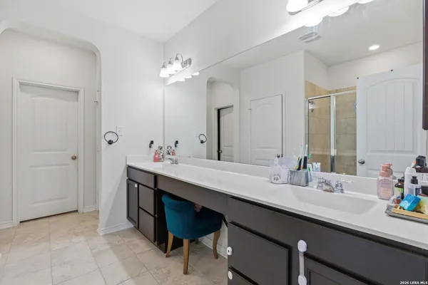 a bathroom with a sink double vanity and a mirror