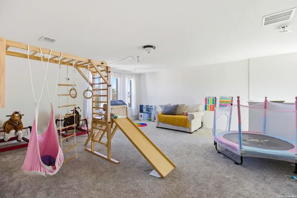 a reading room with furniture and a table