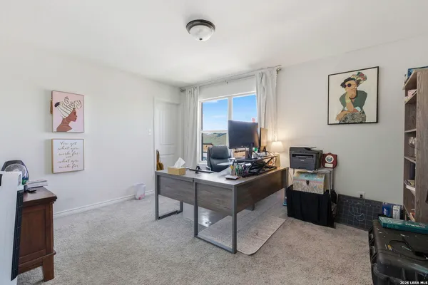 a view of a workspace with furniture