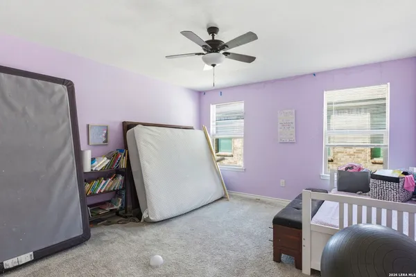a bed room with furniture and a window