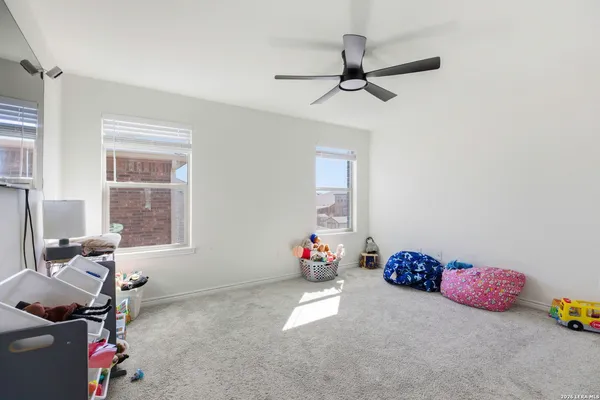 a view of a livingroom with furniture and a window