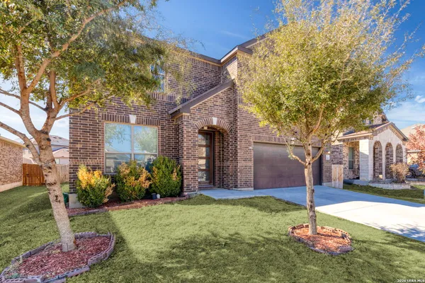 a brick building with a yard