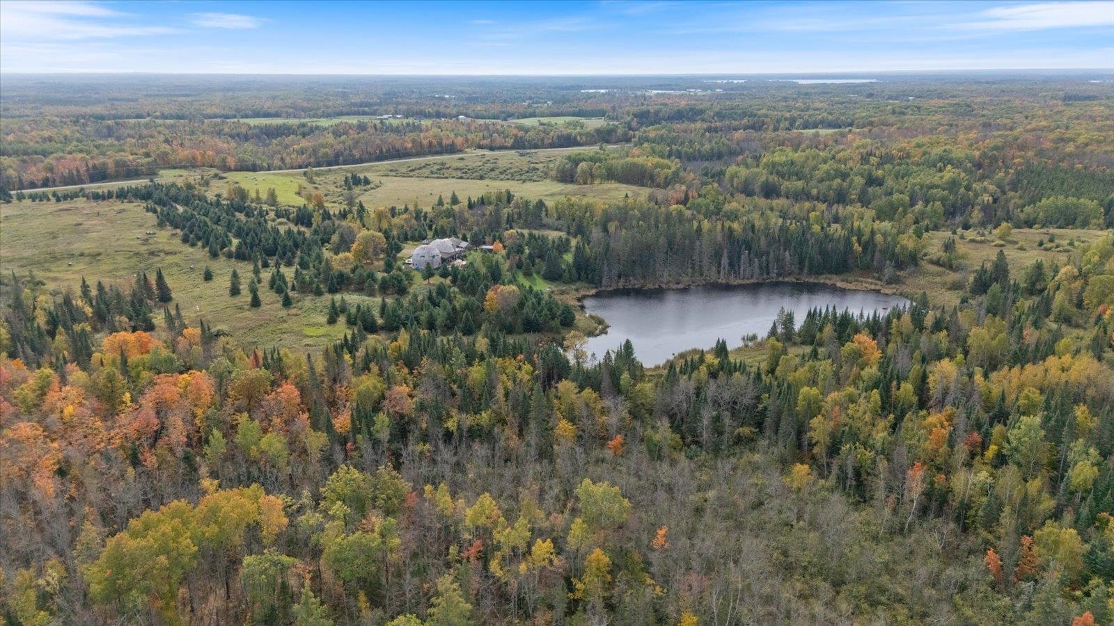 3581 County Line Road Sturgeon Lake, MN 55783 - Photo 12 of 85 View of property location with a nearby body of water and a heavily wooded area