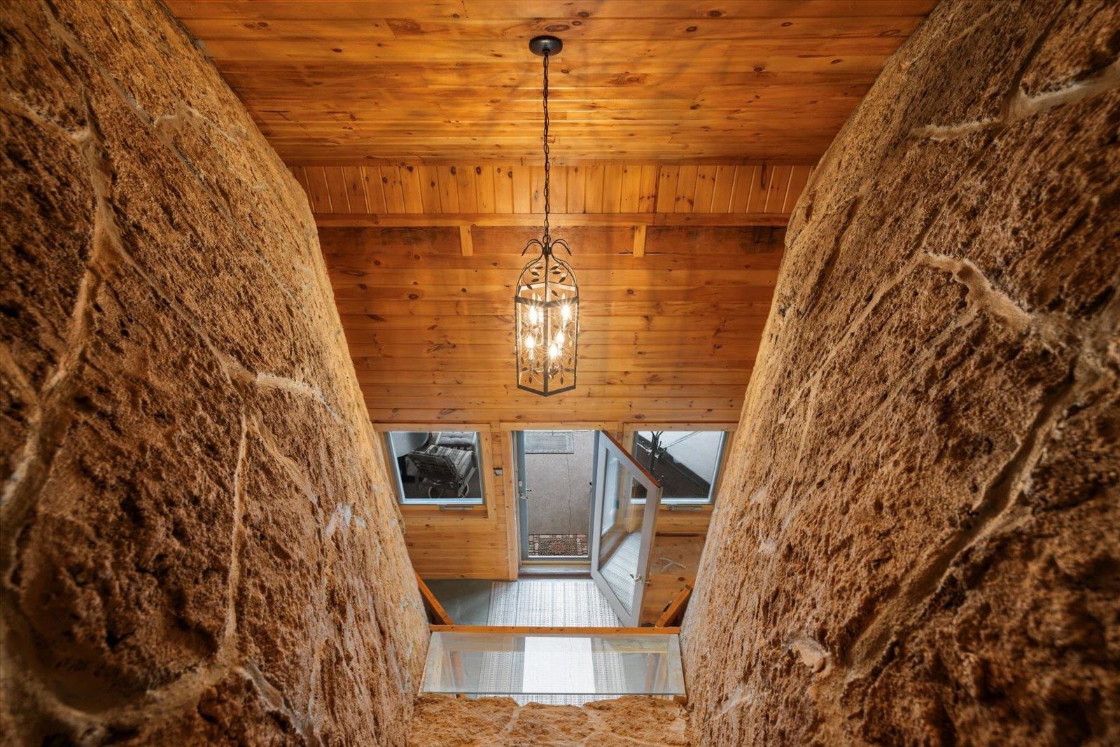 3581 County Line Road Sturgeon Lake, MN 55783 - Photo 22 of 85 Entrance foyer with wooden ceiling and a chandelier