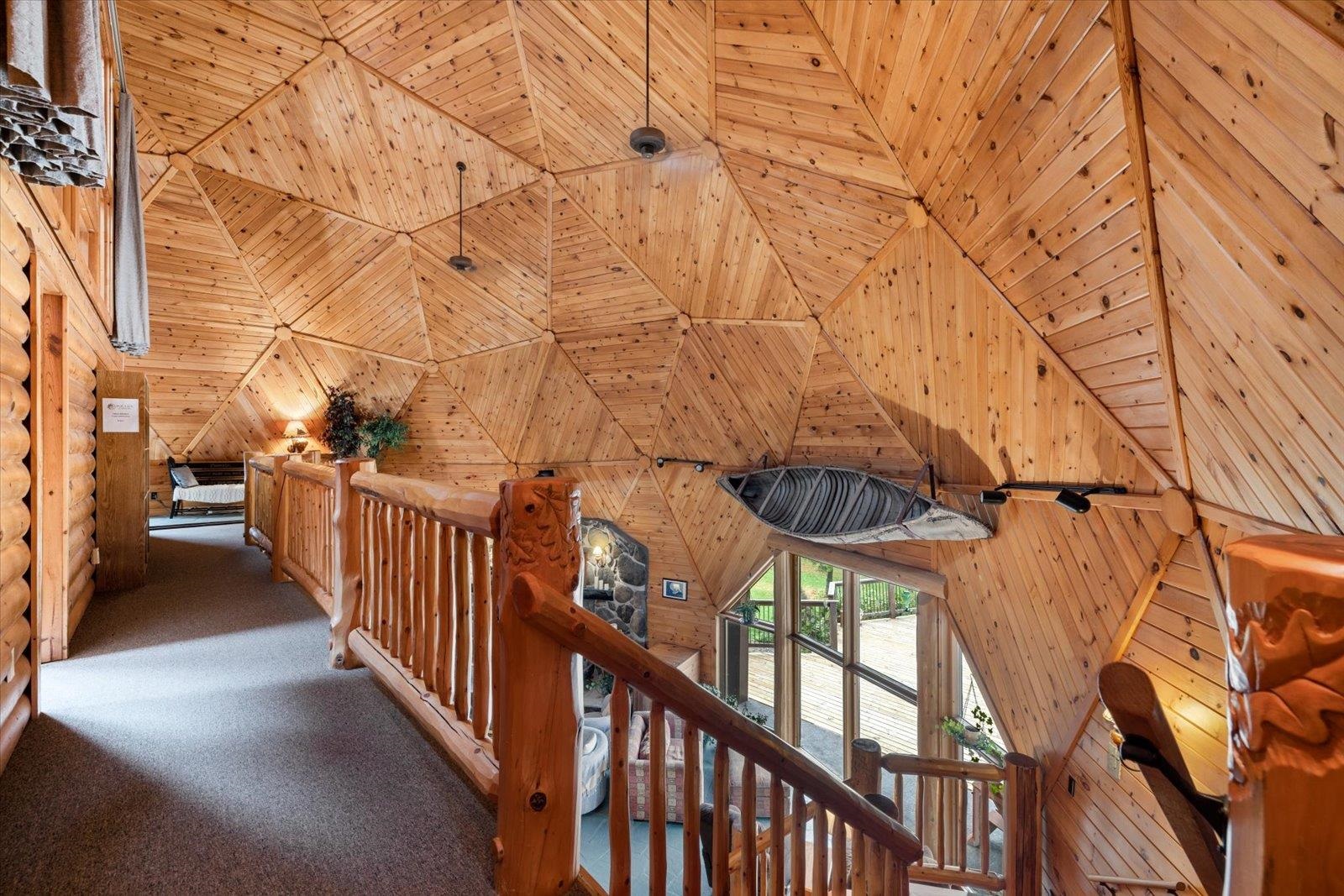 3581 County Line Road Sturgeon Lake, MN 55783 - Photo 5 of 85 Corridor featuring wood walls, wood ceiling, carpet flooring, and lofted ceiling