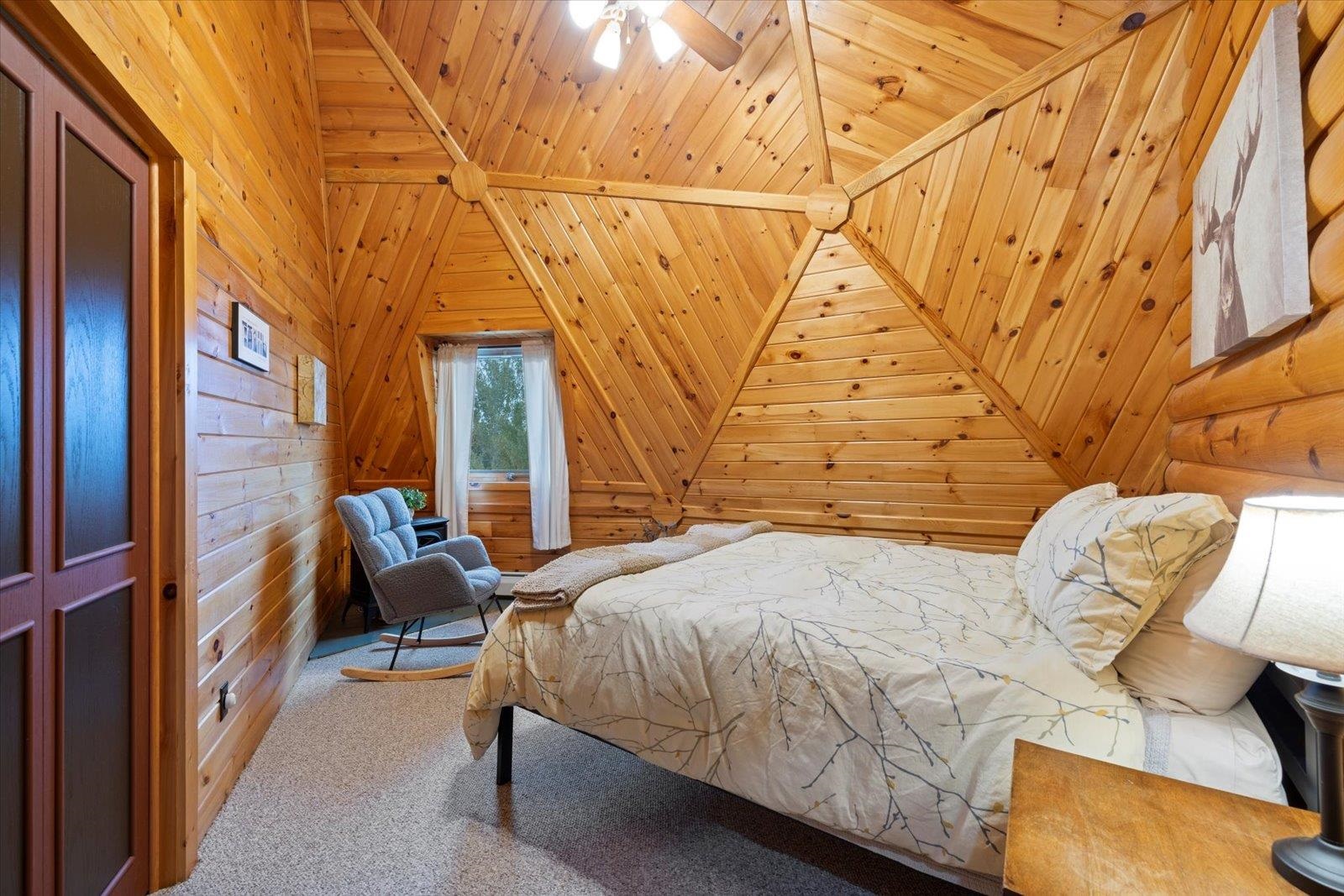 3581 County Line Road Sturgeon Lake, MN 55783 - Photo 52 of 85 Bedroom featuring carpet, wooden walls, wood ceiling, and ceiling fan