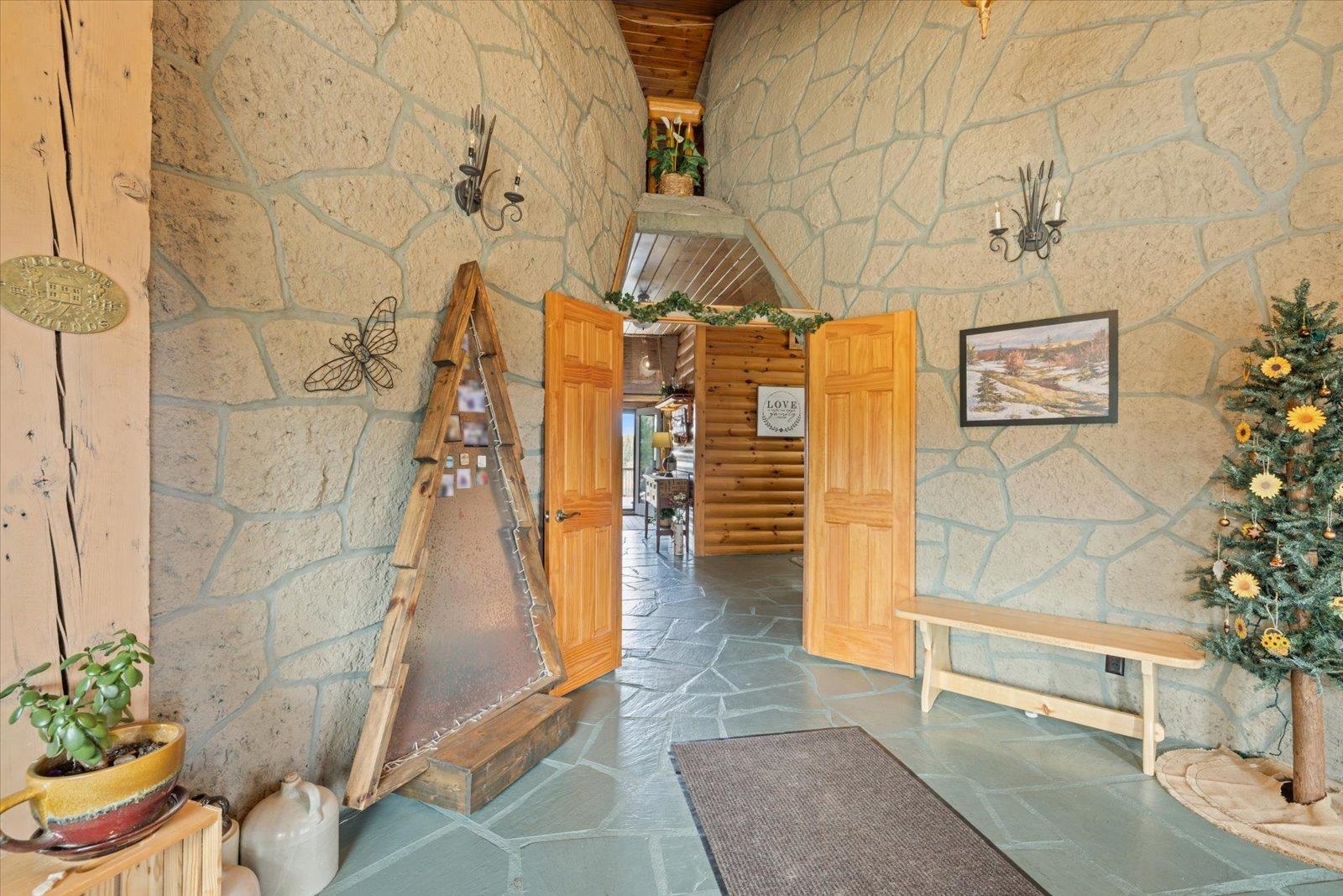 3581 County Line Road Sturgeon Lake, MN 55783 - Photo 7 of 85 Hallway with stone floors and a high ceiling