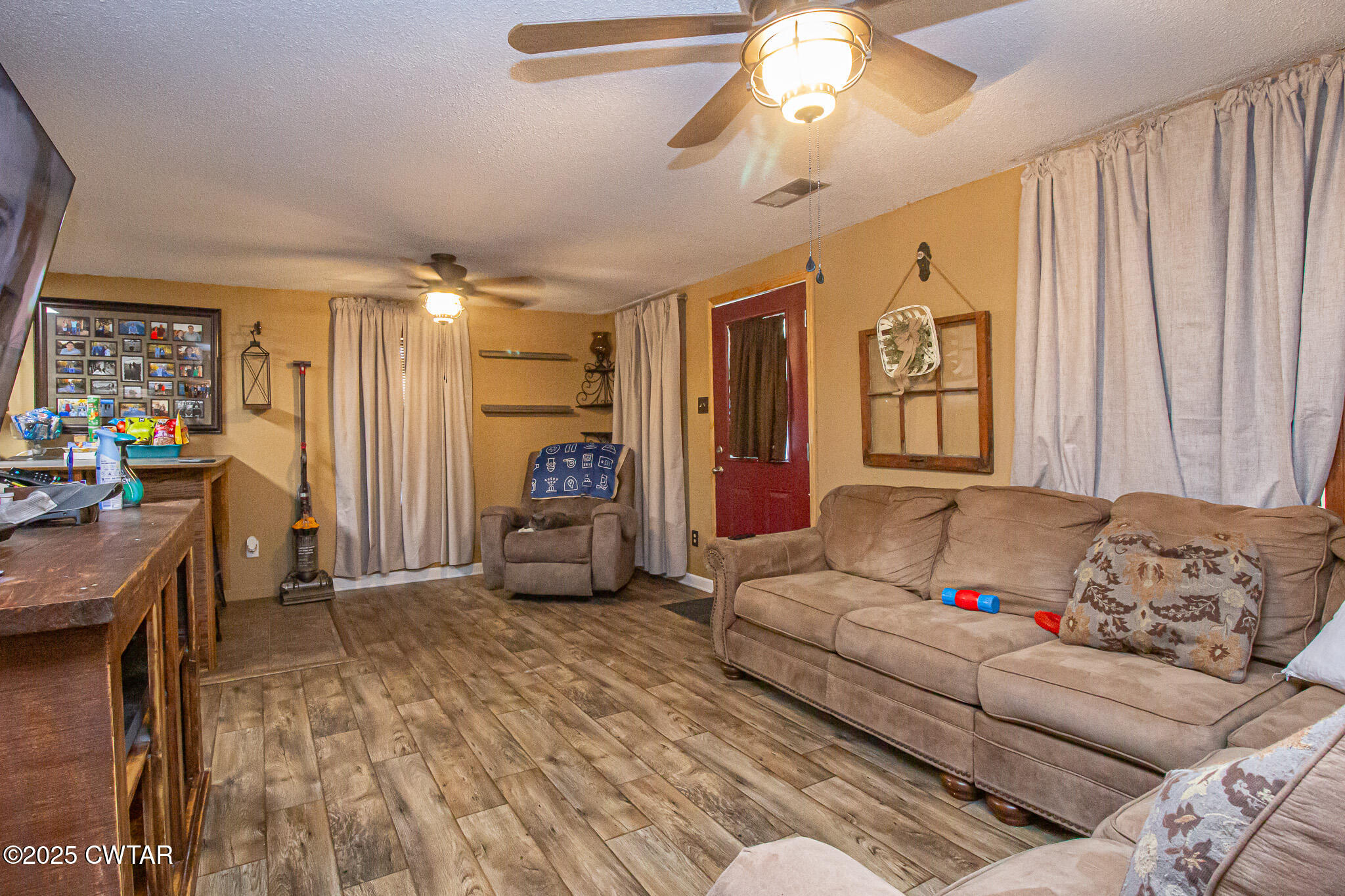 60 Moore Avenue Friendship, TN 38034 - Photo 4 of 14 a living room with furniture and a large window