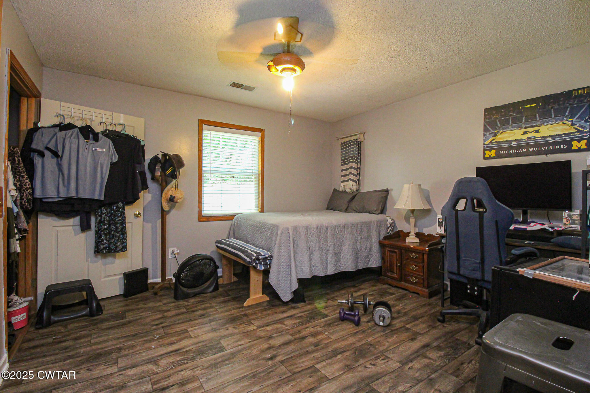 60 Moore Avenue Friendship, TN 38034 - Photo 9 of 14 a bedroom with bed and a chandelier