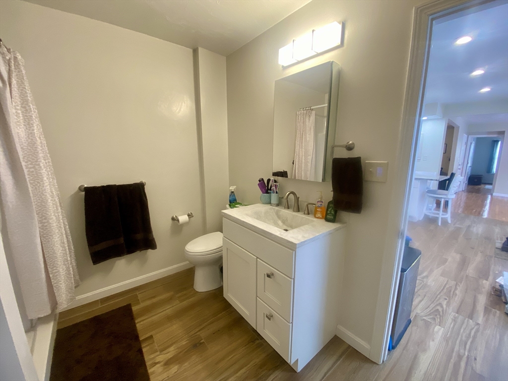 82 Mill Street Worcester, MA 01603 - Photo 16 of 39 a bathroom with a sink and a mirror