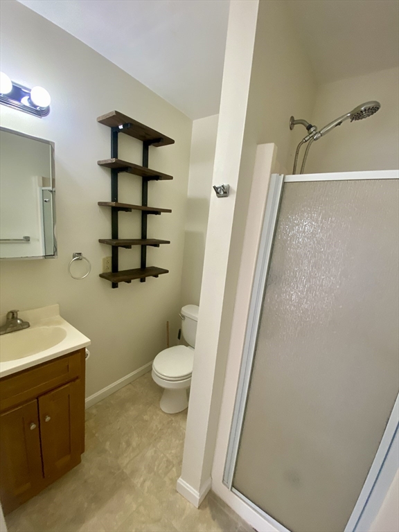 82 Mill Street Worcester, MA 01603 - Photo 25 of 39 a bathroom with a sink a toilet and shower