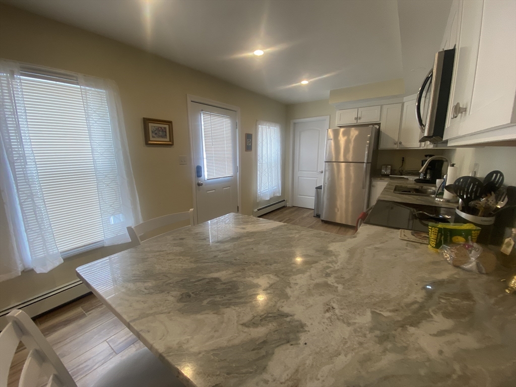 82 Mill Street Worcester, MA 01603 - Photo 9 of 39 a view of a room with gym equipment