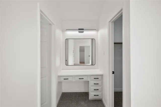 a spacious bathroom with a tub sink shower and mirror