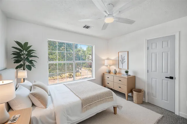 a view of a bathroom from a hallway