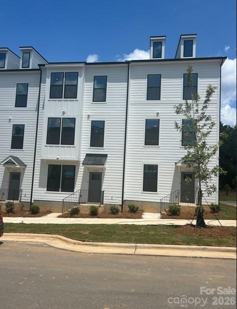 3023 Rozzelles Ferry Road Charlotte, NC 28208 - Photo 1 of 25 a view of building with street light
