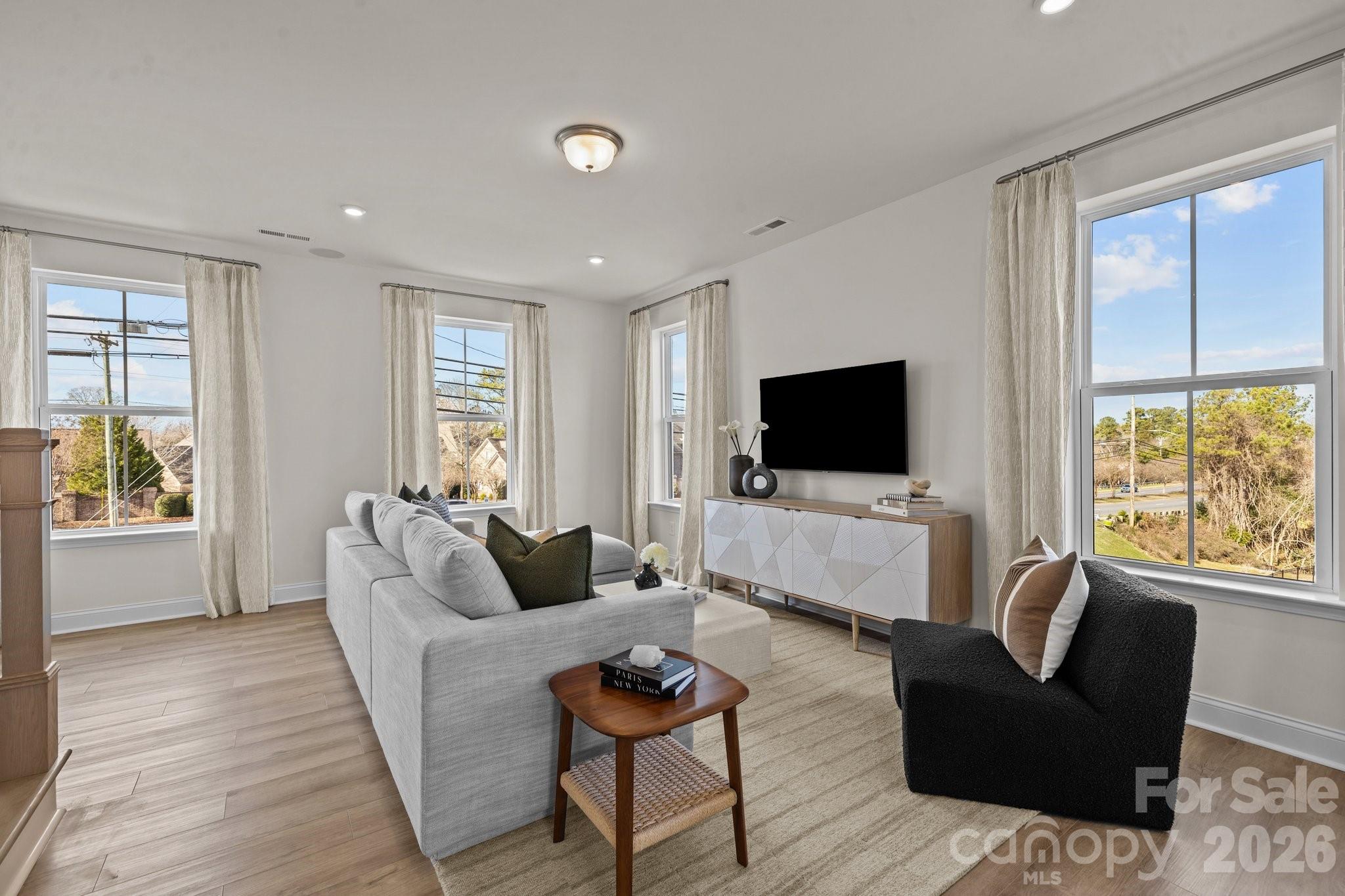 3023 Rozzelles Ferry Road Charlotte, NC 28208 - Photo 12 of 25 a living room with furniture and a flat screen tv