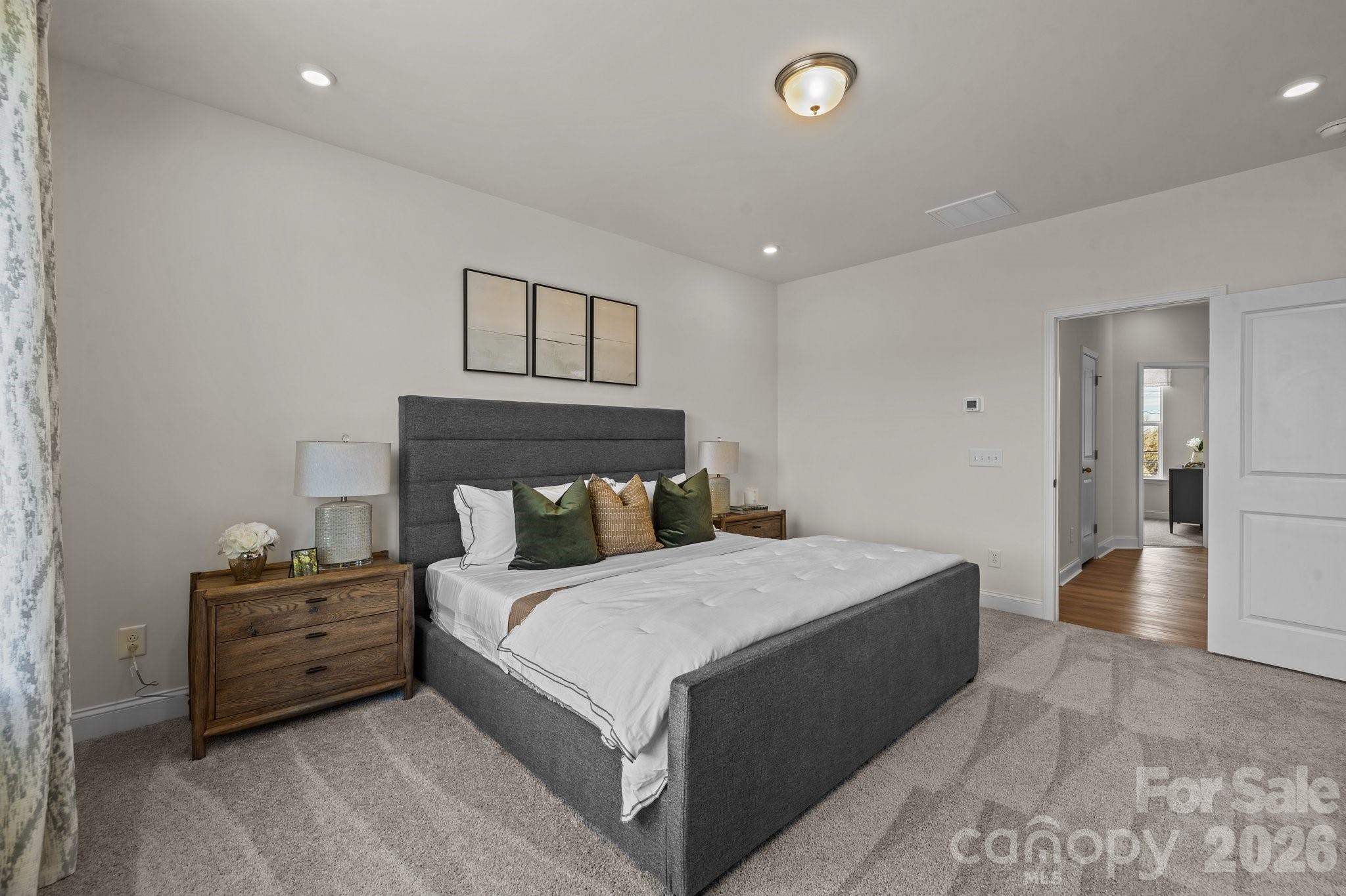 3023 Rozzelles Ferry Road Charlotte, NC 28208 - Photo 14 of 25 a bedroom with a bed and a view of bathroom