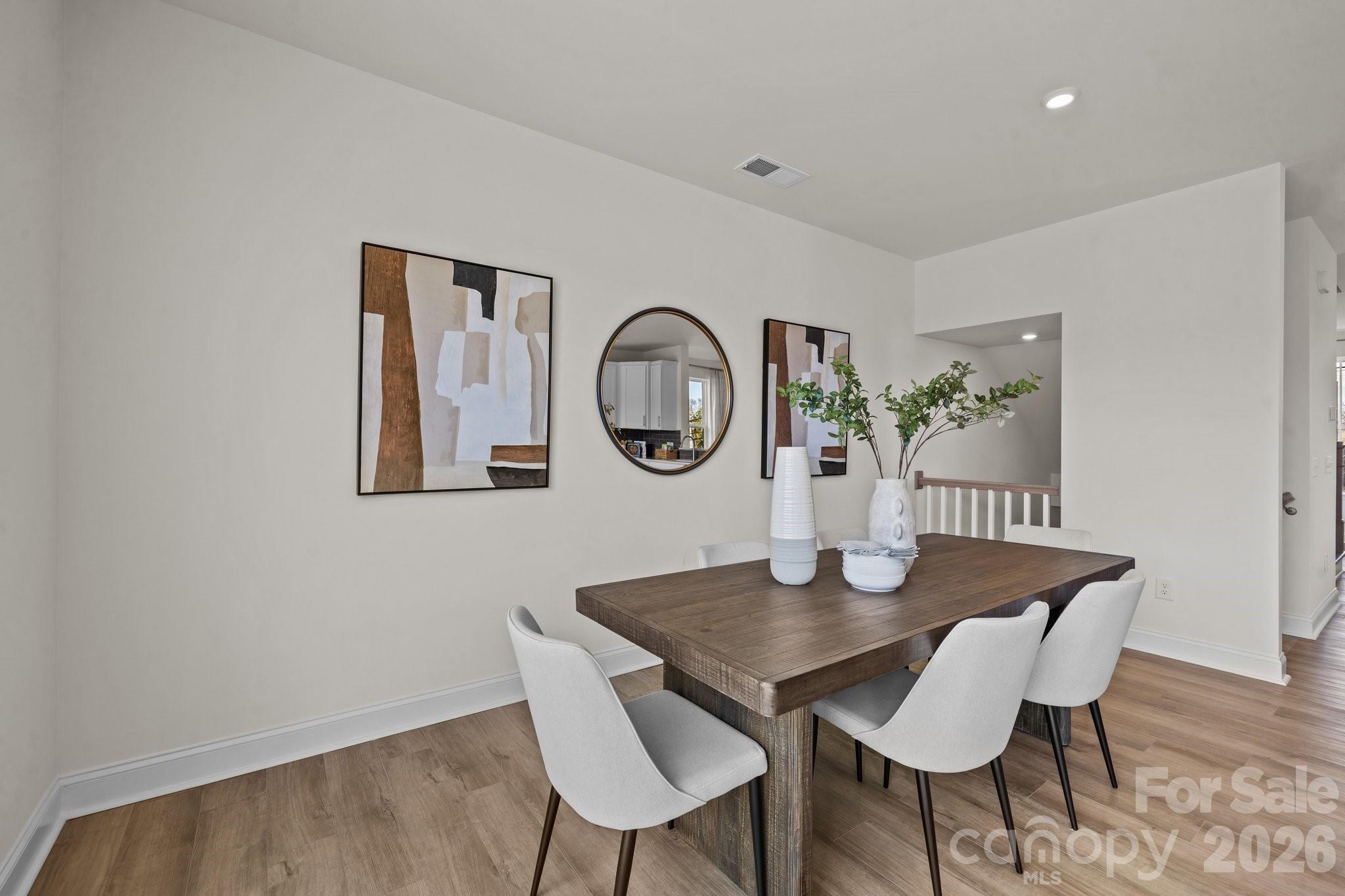 3023 Rozzelles Ferry Road Charlotte, NC 28208 - Photo 7 of 25 a view of a dining room with furniture and wooden floor