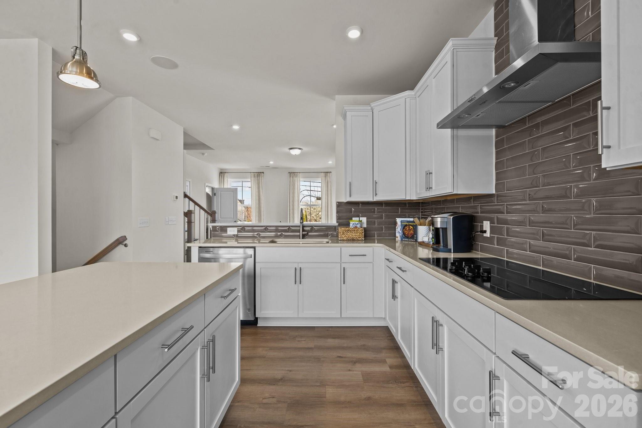 3023 Rozzelles Ferry Road Charlotte, NC 28208 - Photo 8 of 25 a kitchen with granite countertop white cabinets and white appliances