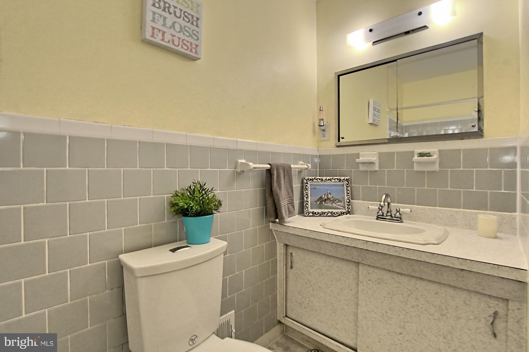 7910 Greeley Boulevard Springfield, VA 22152 - Photo 19 of 29 Hall Bath with mid-century vanity and marble floor
