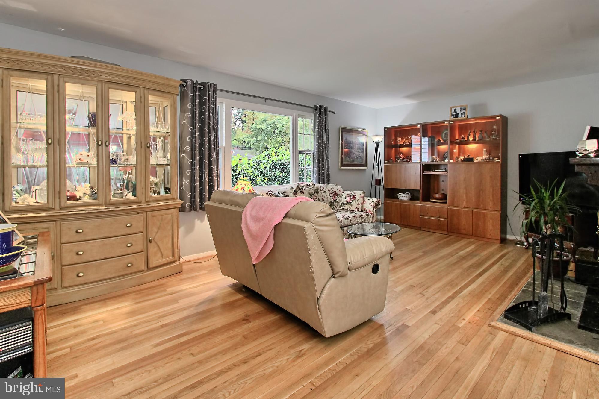 7910 Greeley Boulevard Springfield, VA 22152 - Photo 10 of 29 Polished hardwood floors, south-facing window
