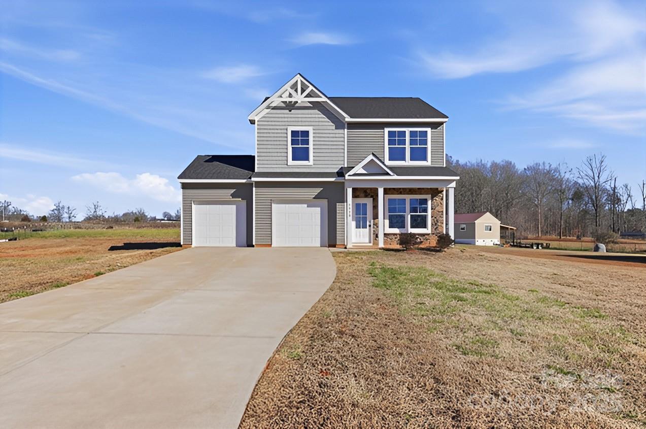 1532 Null Road Lincolnton, NC 28092 - Photo 2 of 32 a front view of a house with a yard and lake view