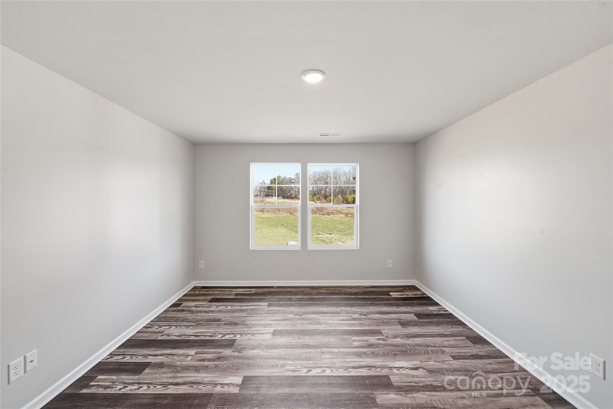 1532 Null Road Lincolnton, NC 28092 - Photo 3 of 32 wooden floor in an empty room with a window