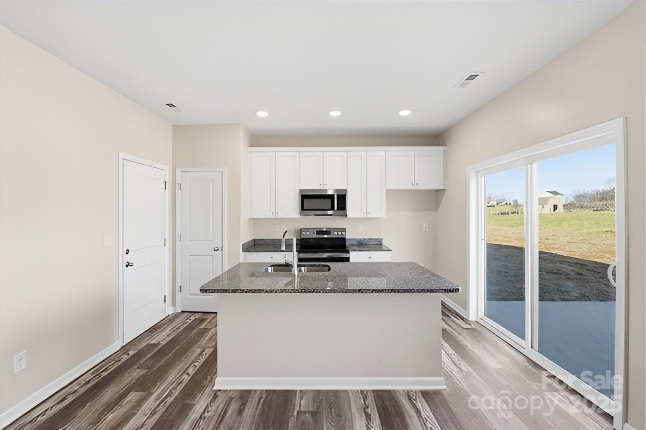 1532 Null Road Lincolnton, NC 28092 - Photo 6 of 32 a large white kitchen with sink stove and refrigerator
