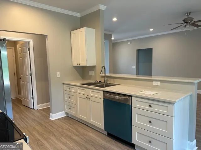 a bathroom with a granite countertop sink a mirror and a shower