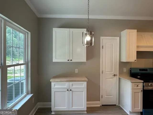 a view of a kitchen with electric appliances