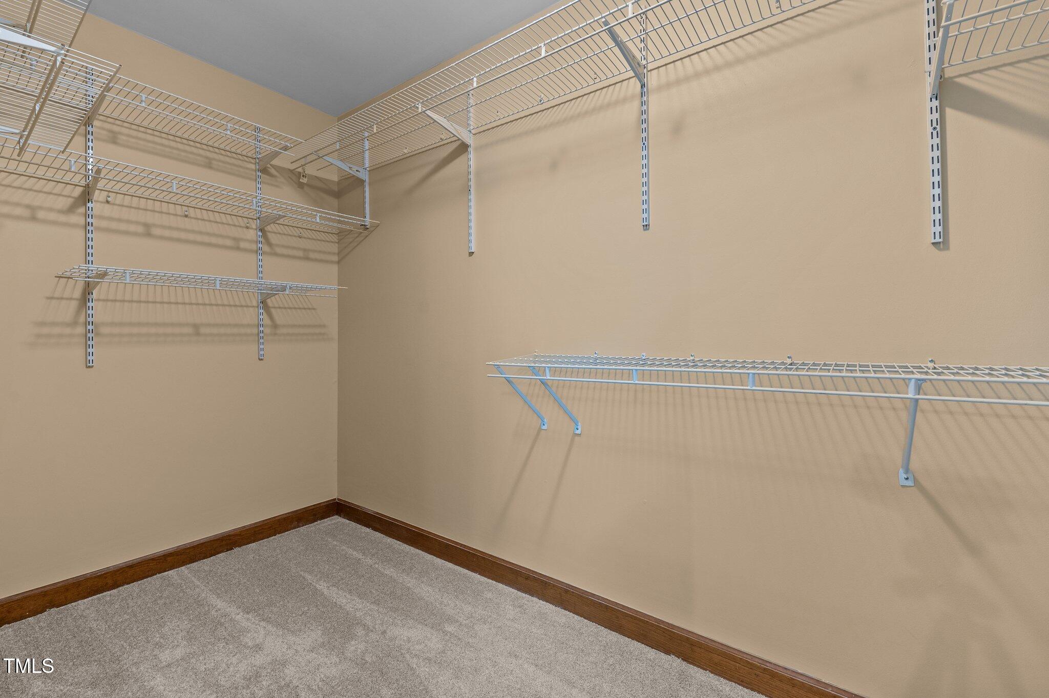5621 Raddington Street Raleigh, NC 27613 - Photo 24 of 34 Primary Walk in Closet