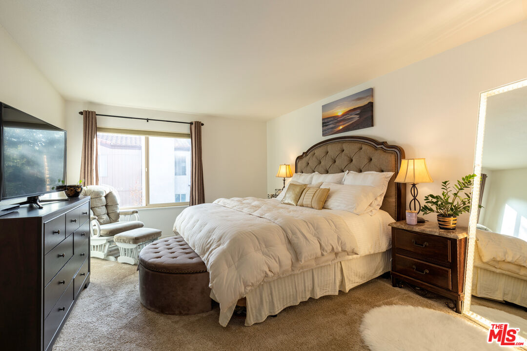 1754 Sinaloa Road, Unit 274 Simi Valley, CA 93065 - Photo 12 of 23 a bedroom with a bed and a flat screen tv
