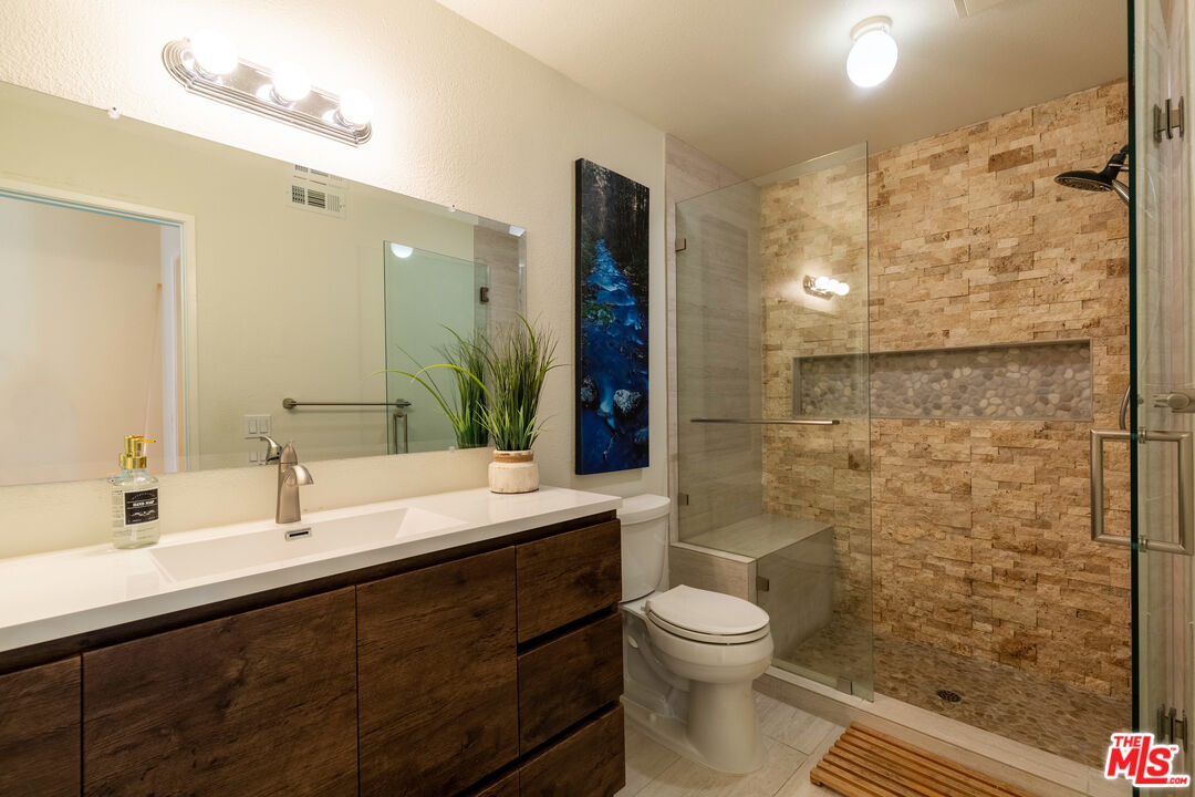 1754 Sinaloa Road, Unit 274 Simi Valley, CA 93065 - Photo 13 of 23 a bathroom with a sink a toilet and shower