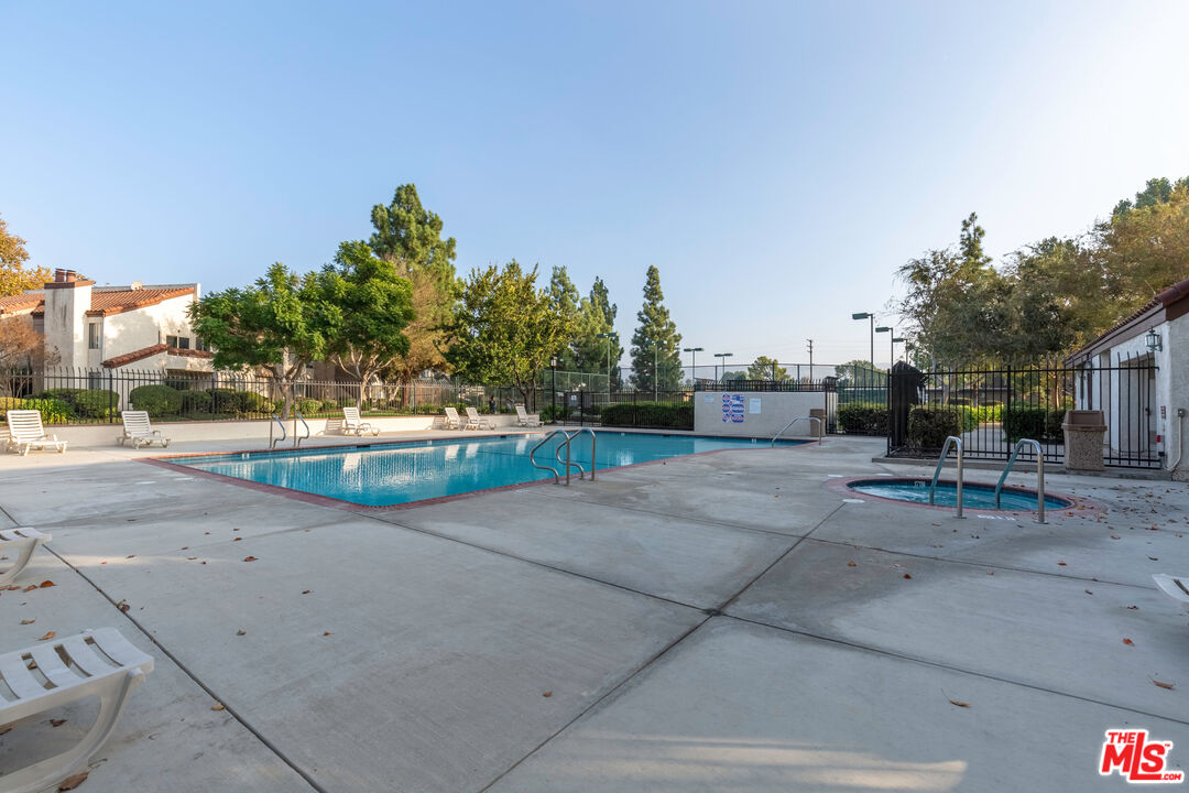 1754 Sinaloa Road, Unit 274 Simi Valley, CA 93065 - Photo 17 of 23 a view of backyard with a parked car