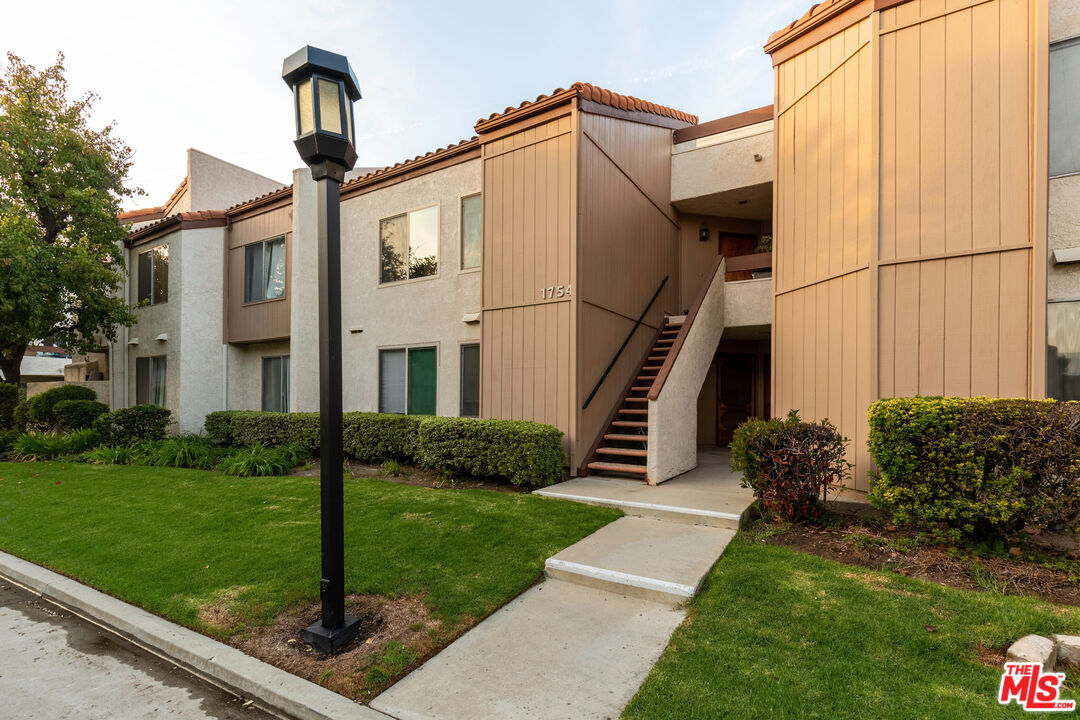 1754 Sinaloa Road, Unit 274 Simi Valley, CA 93065 - Photo 3 of 23 a front view of a house with garden