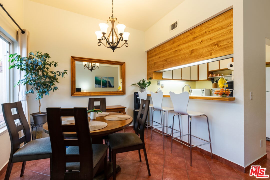 1754 Sinaloa Road, Unit 274 Simi Valley, CA 93065 - Photo 4 of 23 a view of a dining room with furniture and wooden floor